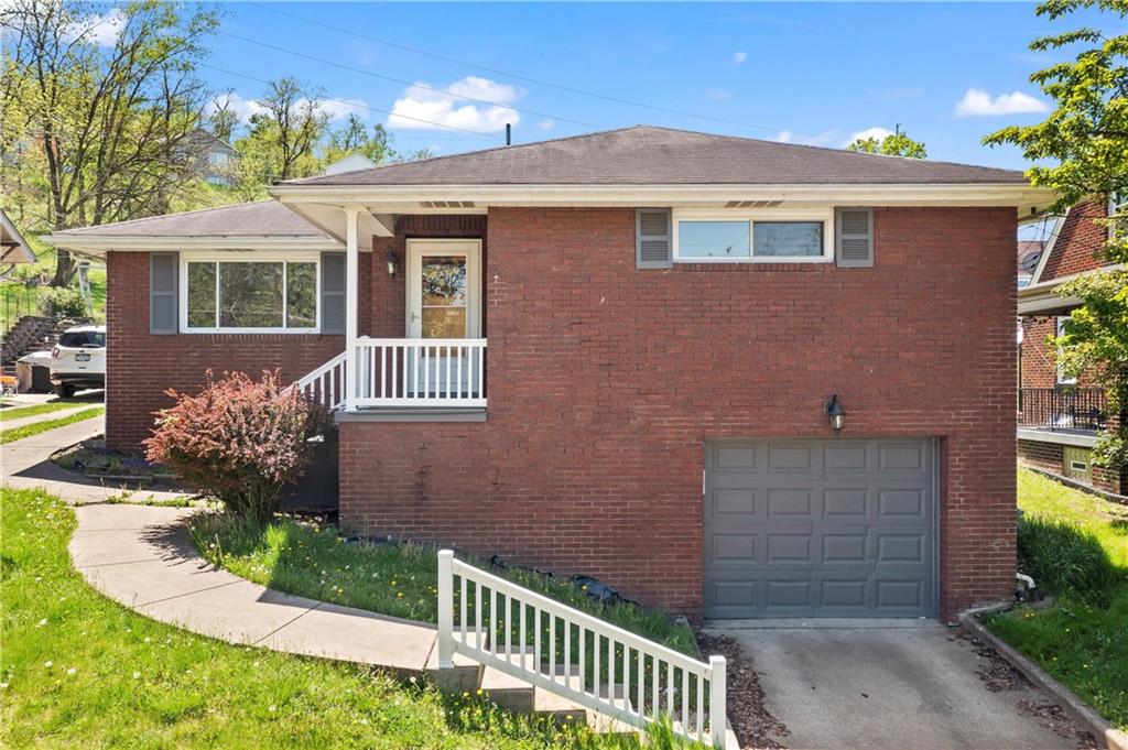 210 Springfield Avenue Washington, PA 15301 - Photo 1 of 28 a front view of a house with a garden