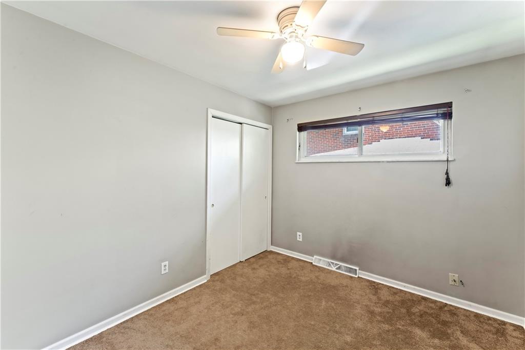 210 Springfield Avenue Washington, PA 15301 - Photo 19 of 28 a view of an empty room with a fan