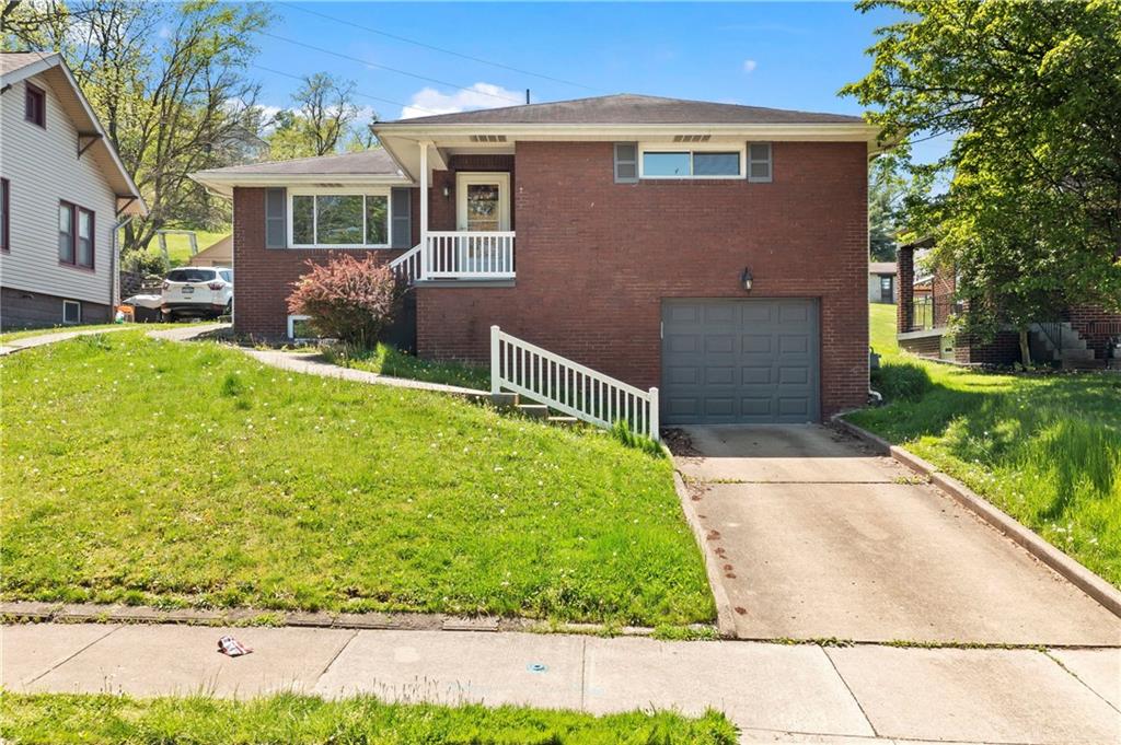 210 Springfield Avenue Washington, PA 15301 - Photo 2 of 28 a front view of a house with garden