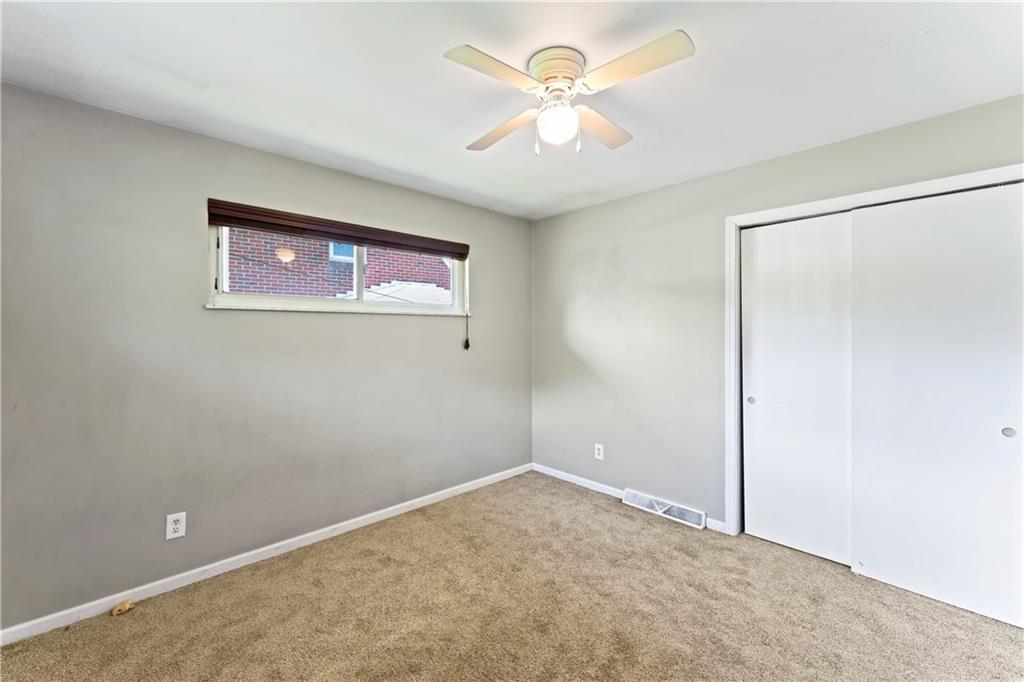 210 Springfield Avenue Washington, PA 15301 - Photo 21 of 28 an empty room with a fan
