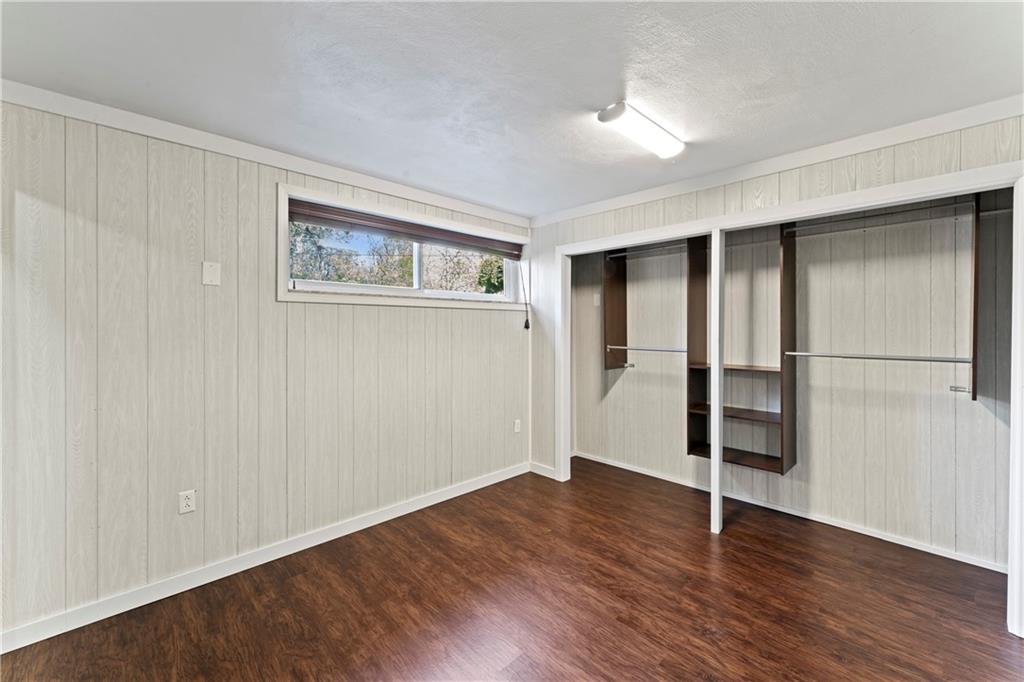 210 Springfield Avenue Washington, PA 15301 - Photo 23 of 28 an empty room with wooden floor closet and windows