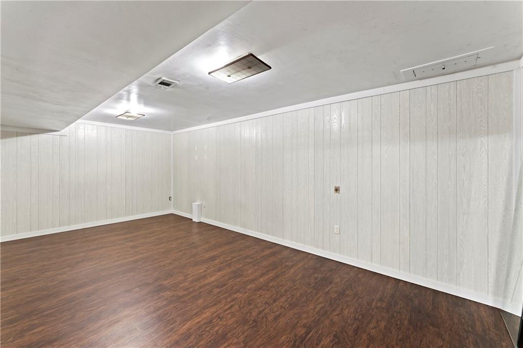 210 Springfield Avenue Washington, PA 15301 - Photo 24 of 28 an empty room with wooden floor and windows