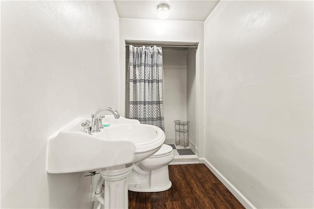 210 Springfield Avenue Washington, PA 15301 - Photo 27 of 28 a bathroom with a sink toilet and mirror