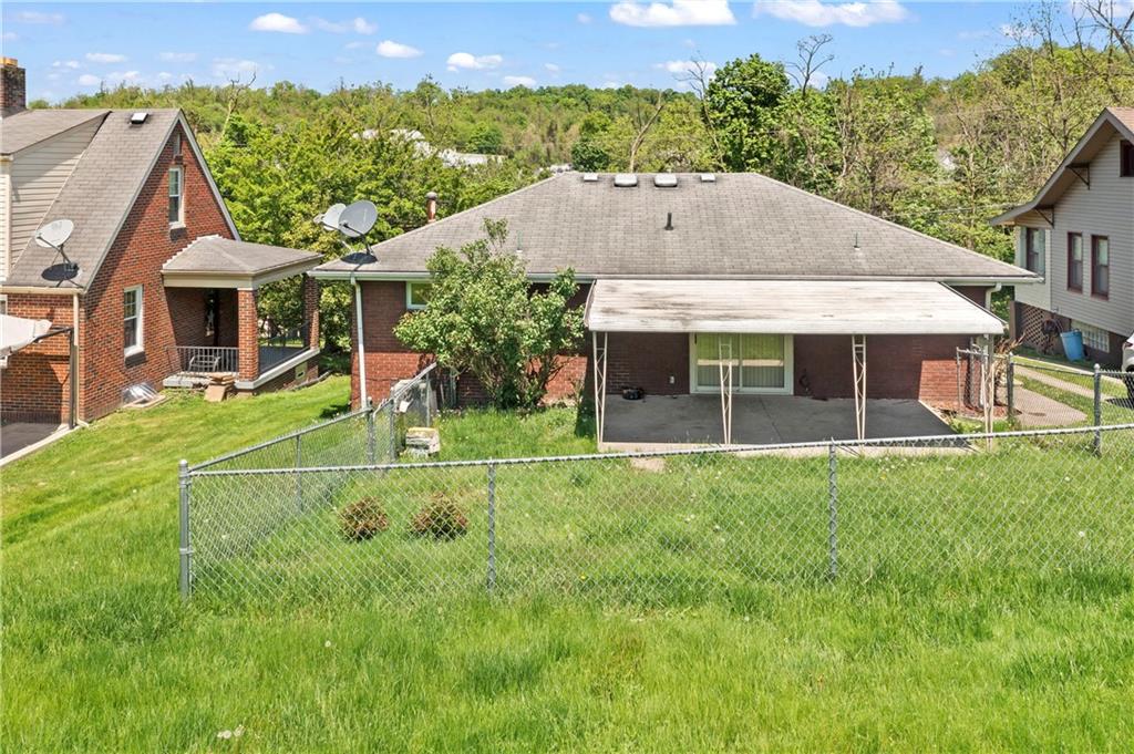 210 Springfield Avenue Washington, PA 15301 - Photo 4 of 28 front view of a house with a yard