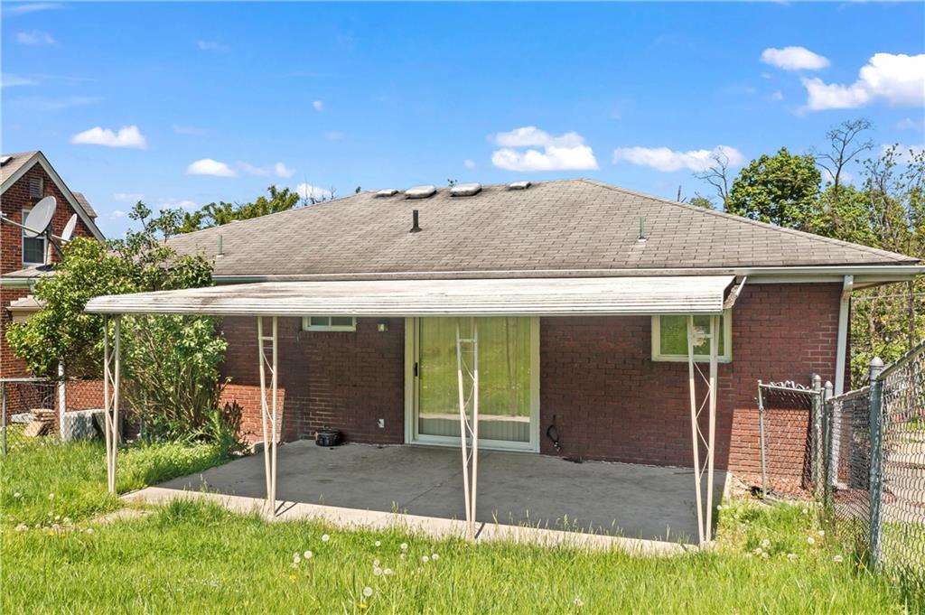 210 Springfield Avenue Washington, PA 15301 - Photo 5 of 28 a view of a house with porch and a backyard
