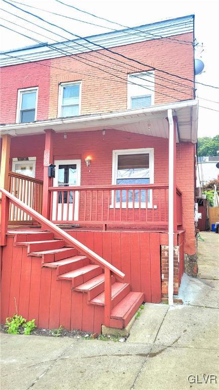 a view of a brick building with many windows
