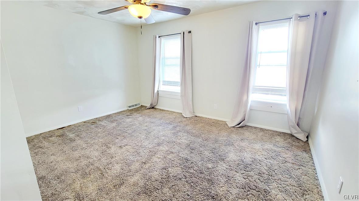 1512 East 7th Street Bethlehem, PA 18015 - Photo 9 of 15 an empty room with a window and chandelier fan