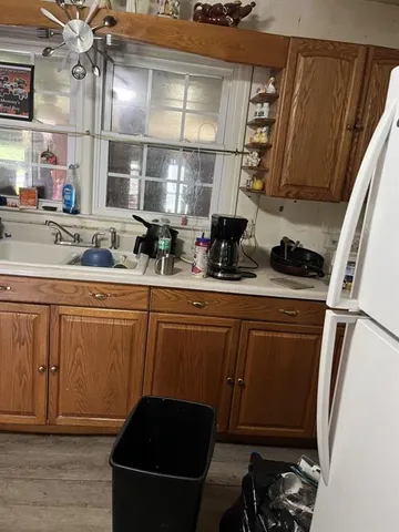 a kitchen with a sink and cabinets