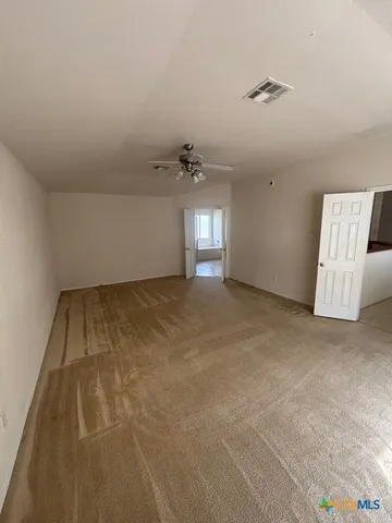 a view of a room with racks on the wall