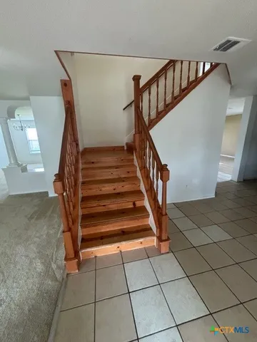 an empty room with a empty space and windows