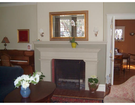 233 Clinton Road Brookline, MA 02445 - Photo 4 of 6 a living room with furniture and a fireplace