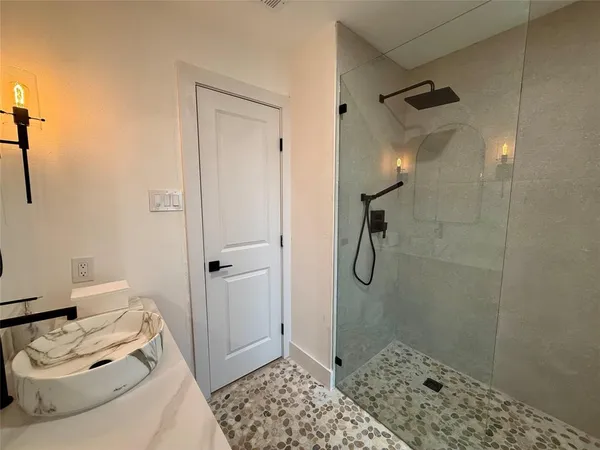 a bathroom with a sink and mirror