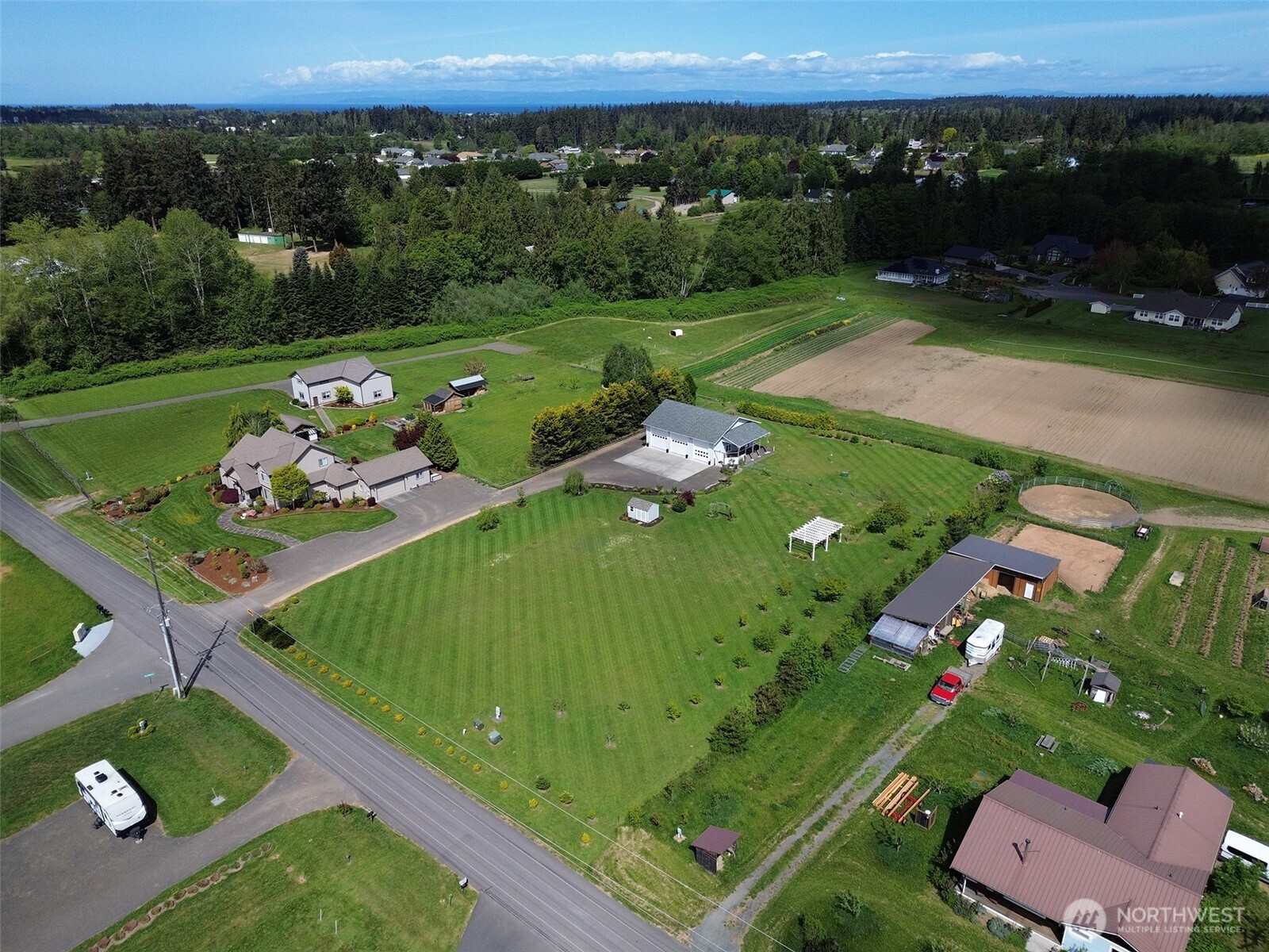 152 Macleay Road Sequim, WA 98382 - Photo 2 of 40 an aerial view of a golf course with chairs