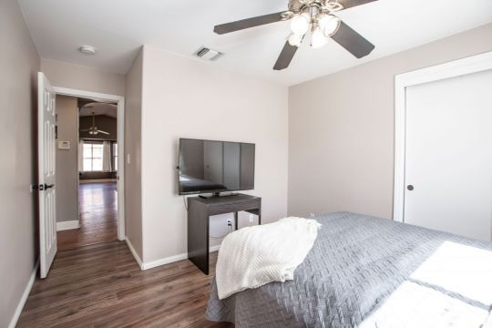 421 Christopher Court Ridgecrest, CA 93555 - Photo 22 of 50 a bedroom with a bed and a flat screen tv