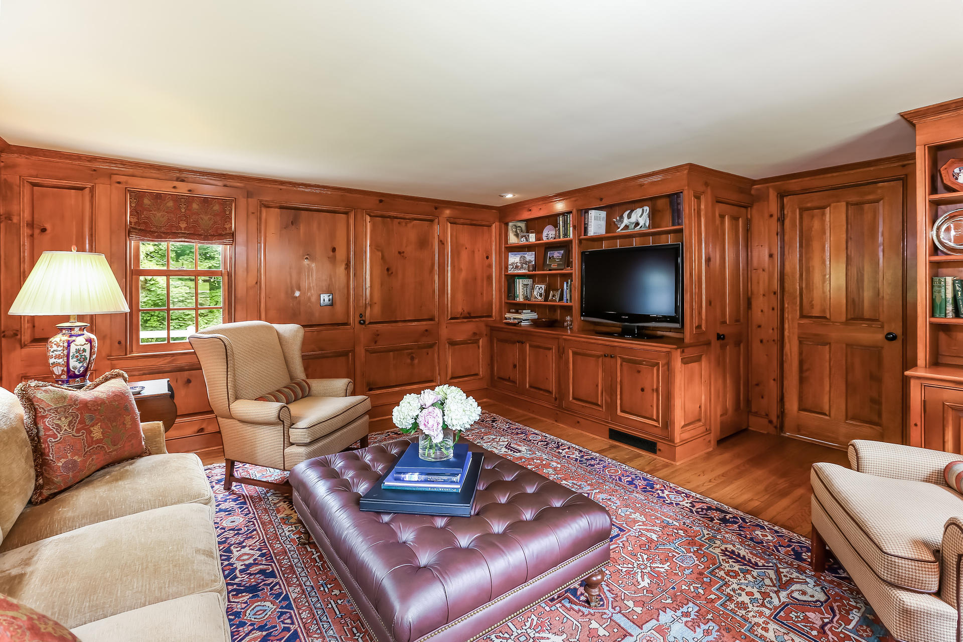 2 Saddle Ridge Road Darien, CT 06820 - Photo 16 of 33 a living room with furniture and a flat screen tv