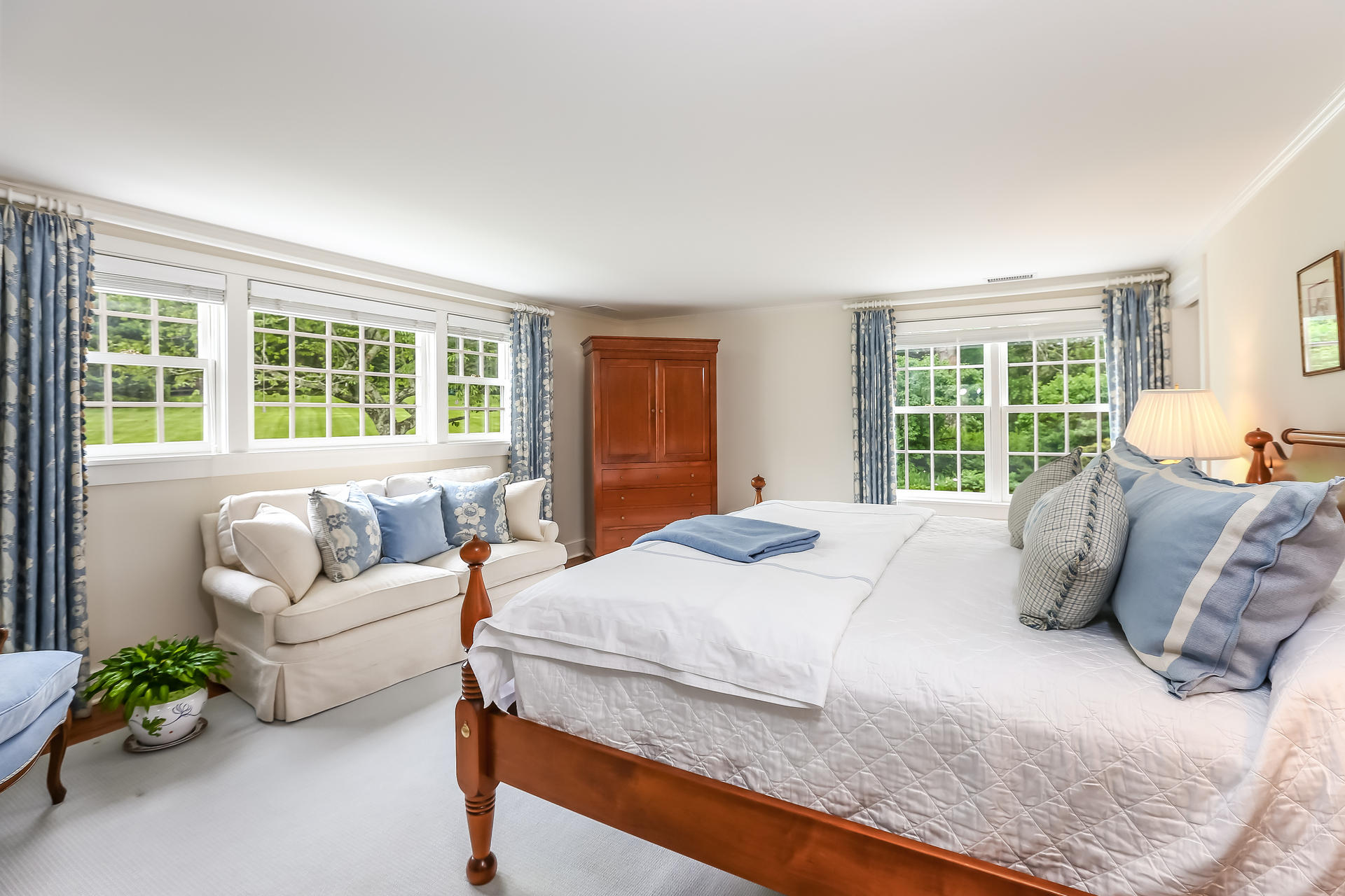 2 Saddle Ridge Road Darien, CT 06820 - Photo 18 of 33 a bedroom with a bed couch and a large window