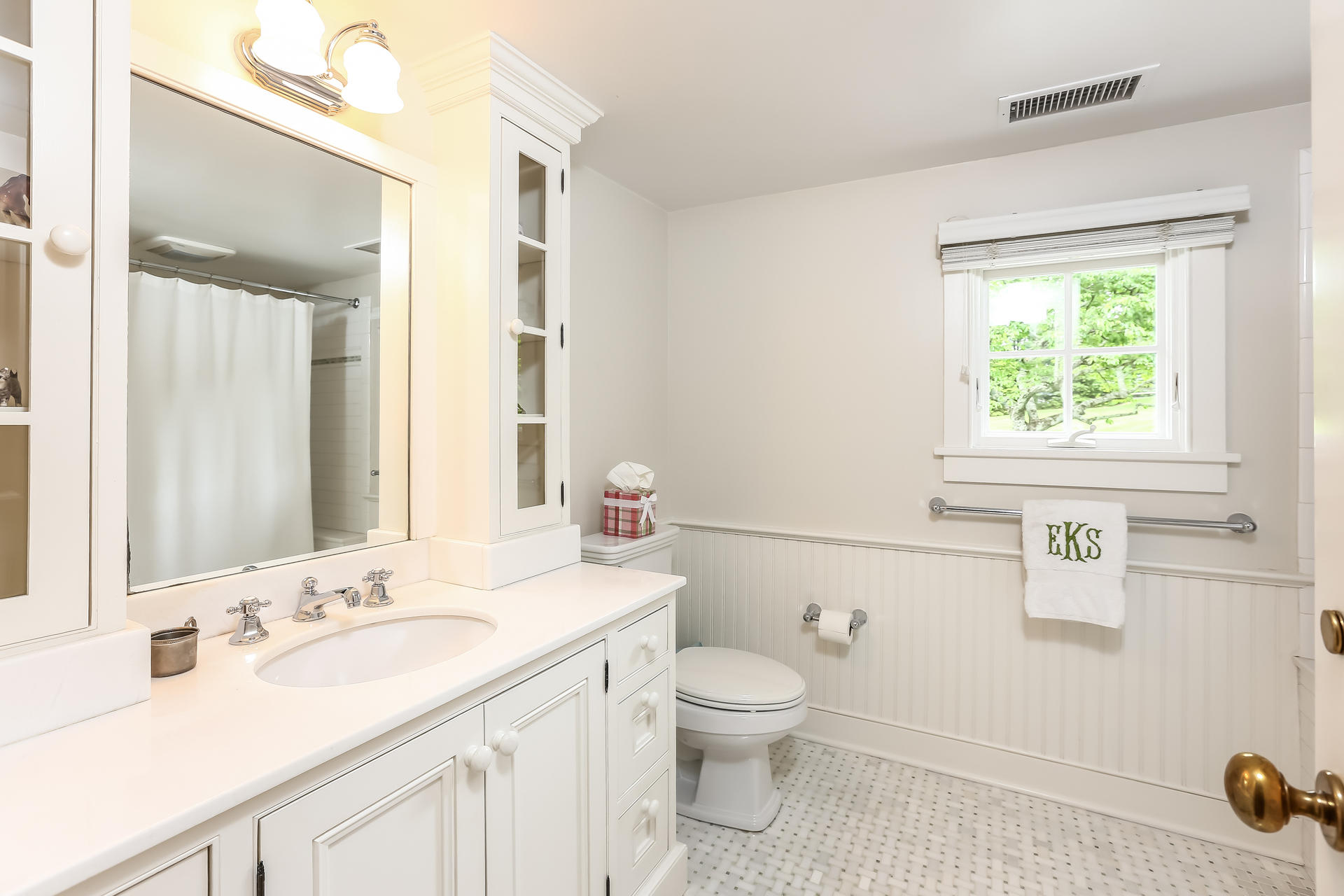 2 Saddle Ridge Road Darien, CT 06820 - Photo 25 of 33 a bathroom with a sink a toilet and a mirror