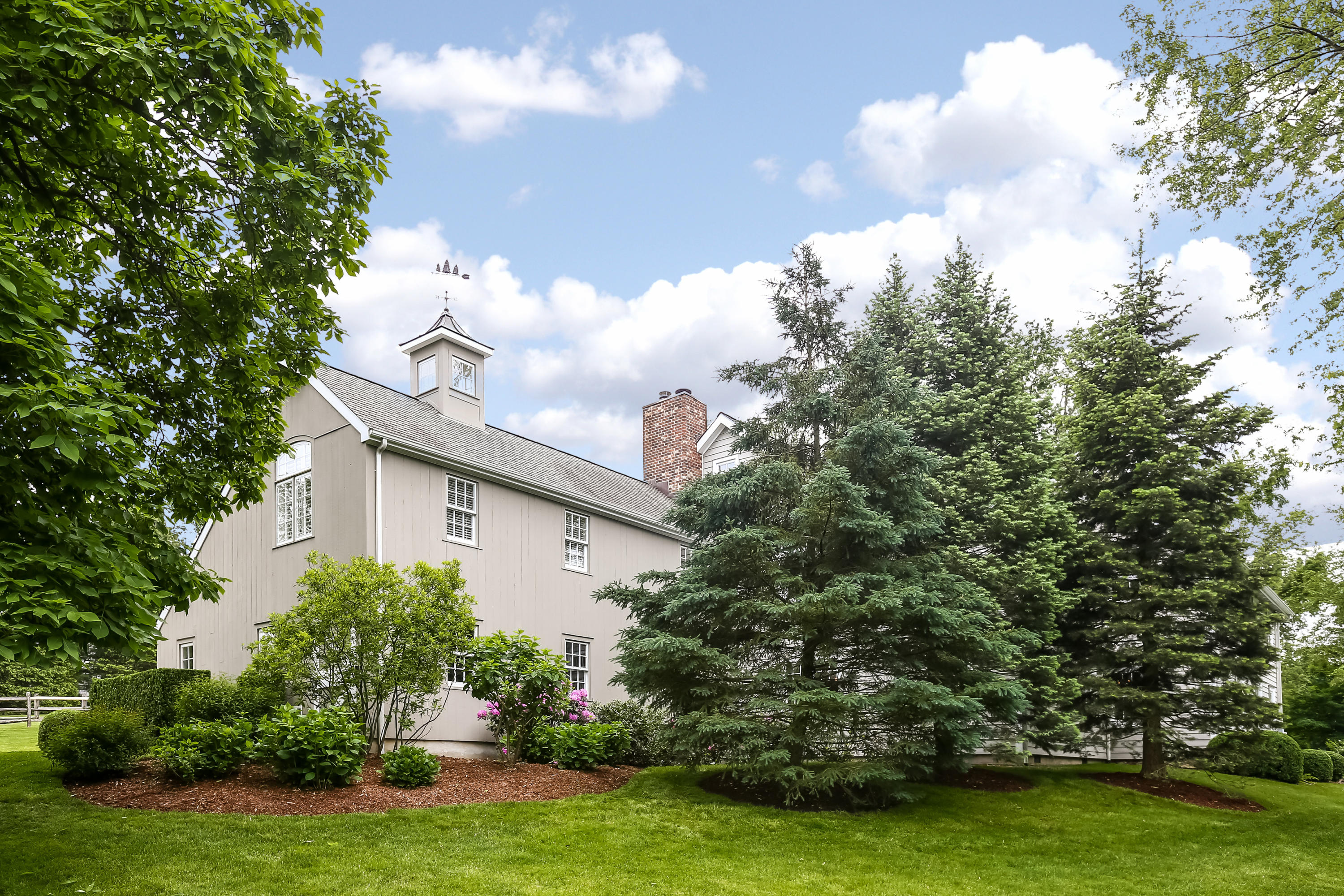 2 Saddle Ridge Road Darien, CT 06820 - Photo 5 of 33 a view of a house with a big yard and garden