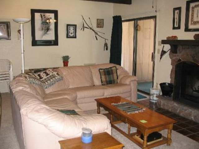2705 Sports Village Loop Pinetop, AZ 85935 - Photo 2 of 5 a living room with furniture and a fireplace
