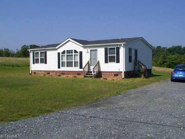 Exterior Front. View from Front of Driveway