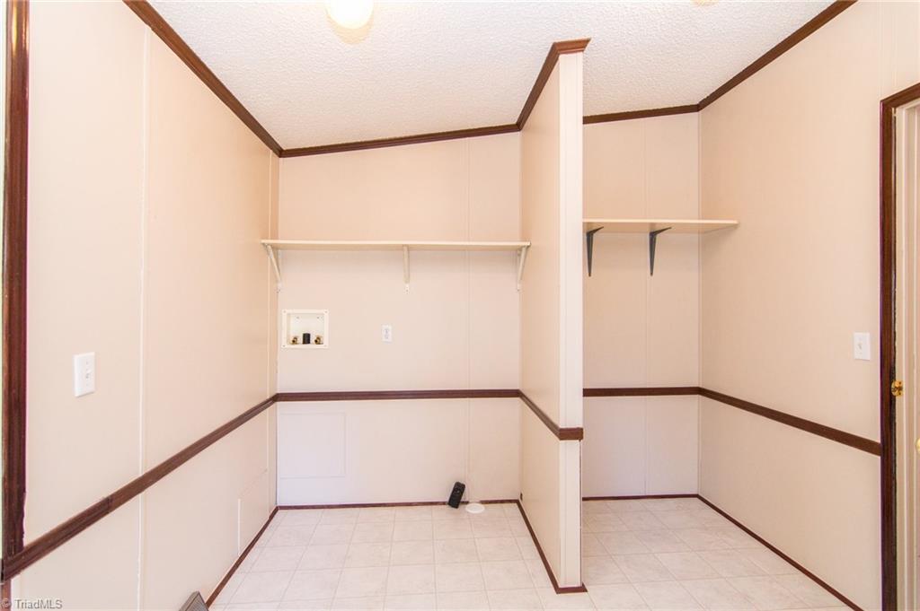 4819 Poplar Ridge Road Trinity, NC 27370 - Photo 11 of 22 Laundry/mud room with large storage area.