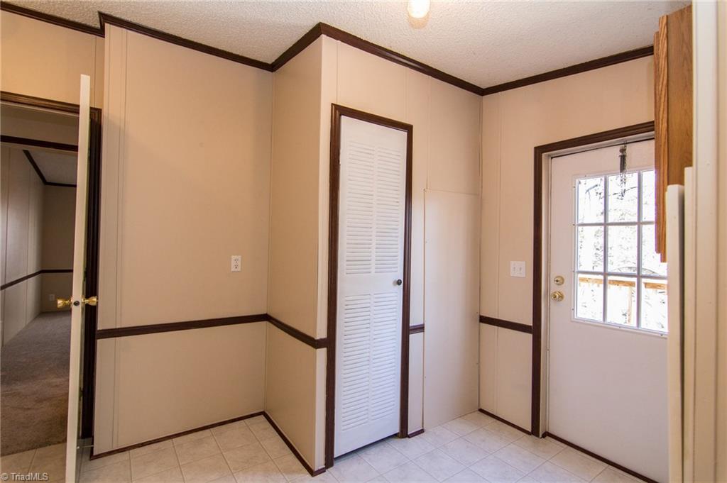 4819 Poplar Ridge Road Trinity, NC 27370 - Photo 12 of 22 Mudroom, door leads to side deck view pond view.