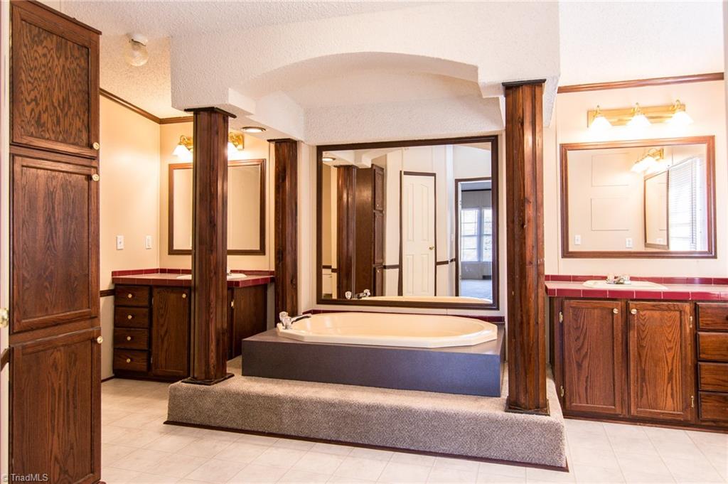 4819 Poplar Ridge Road Trinity, NC 27370 - Photo 17 of 22 Oversized master bath with soaking tub, separate vanities and walk in shower.