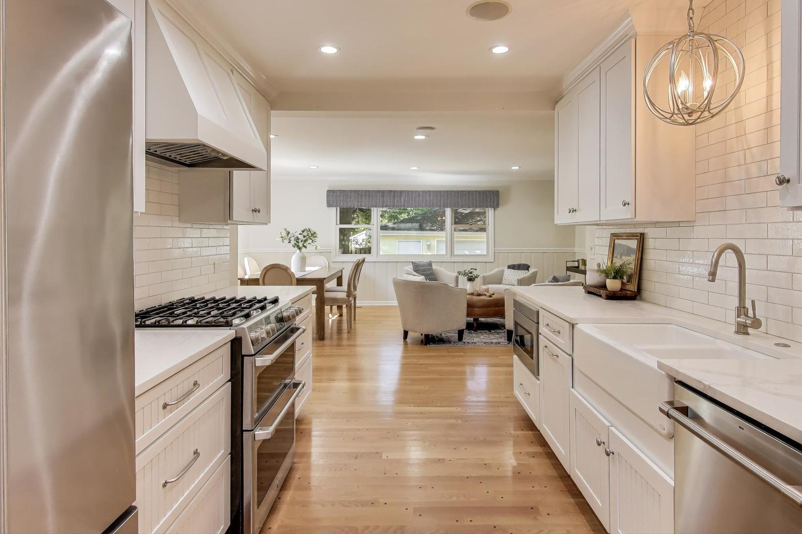 924 Lyford Lane Wheaton, IL 60189 - Photo 11 of 43 a kitchen with stove a sink and cabinets