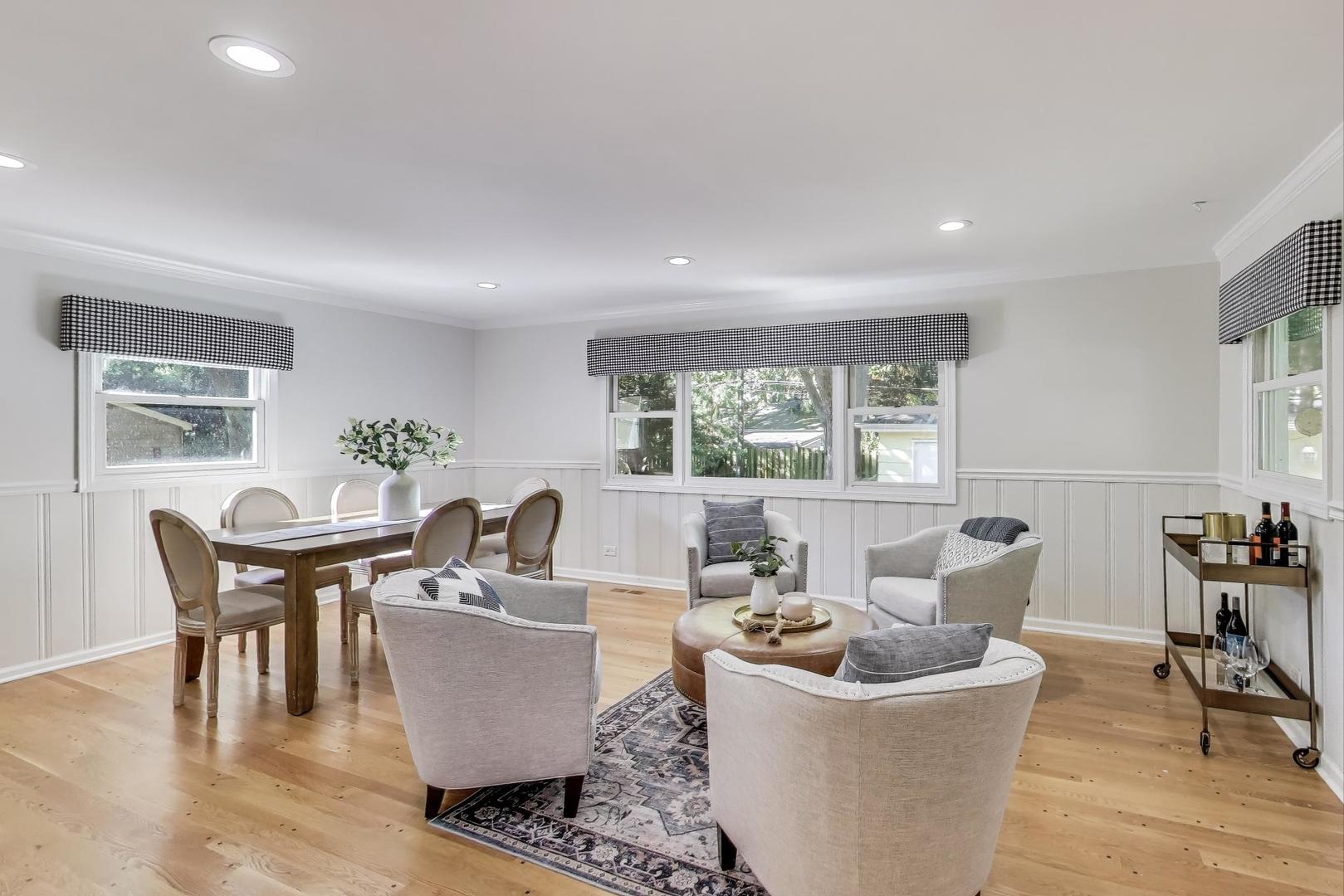 924 Lyford Lane Wheaton, IL 60189 - Photo 12 of 43 a living room with furniture and a large window