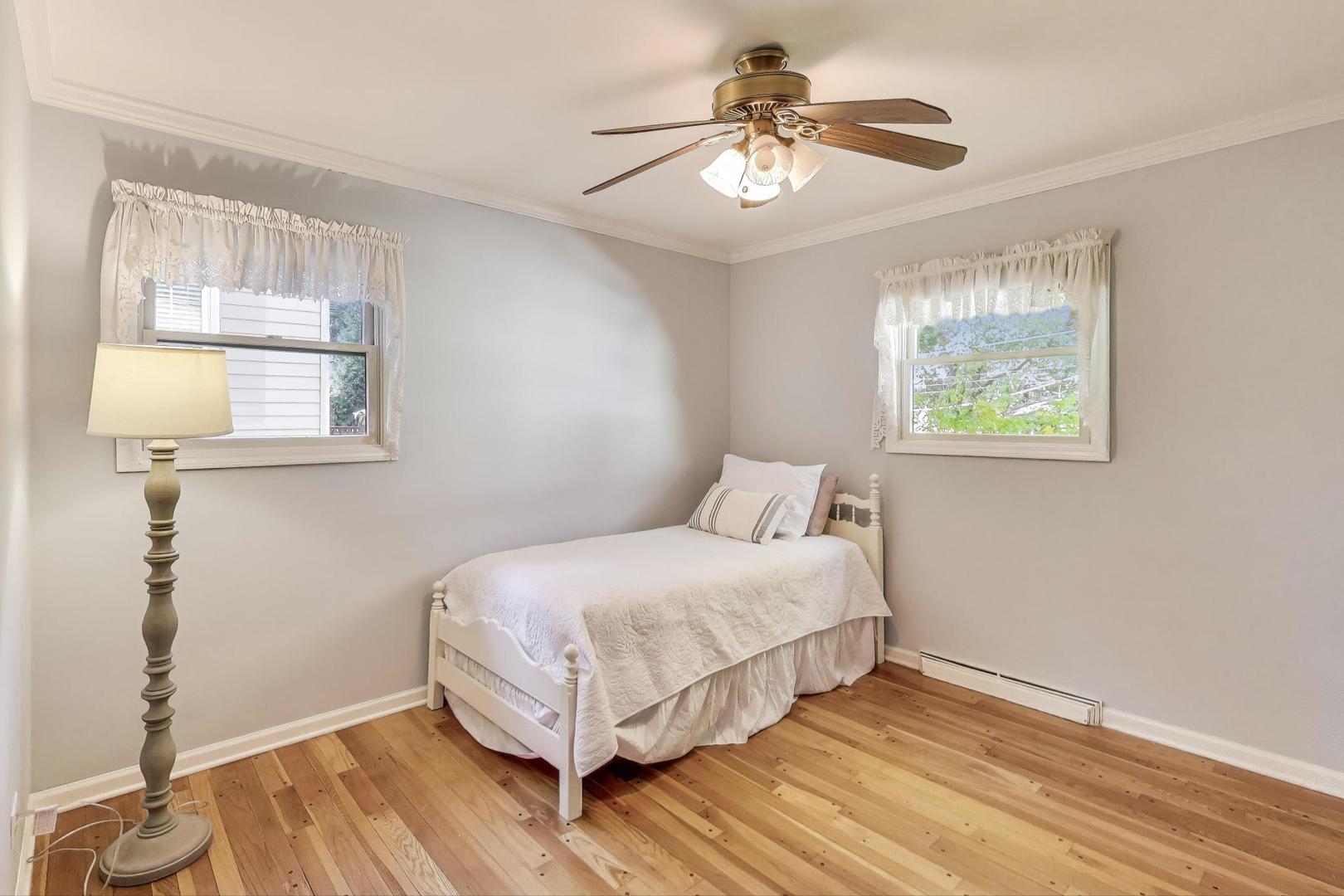 924 Lyford Lane Wheaton, IL 60189 - Photo 18 of 43 a bedroom with a bed and a window