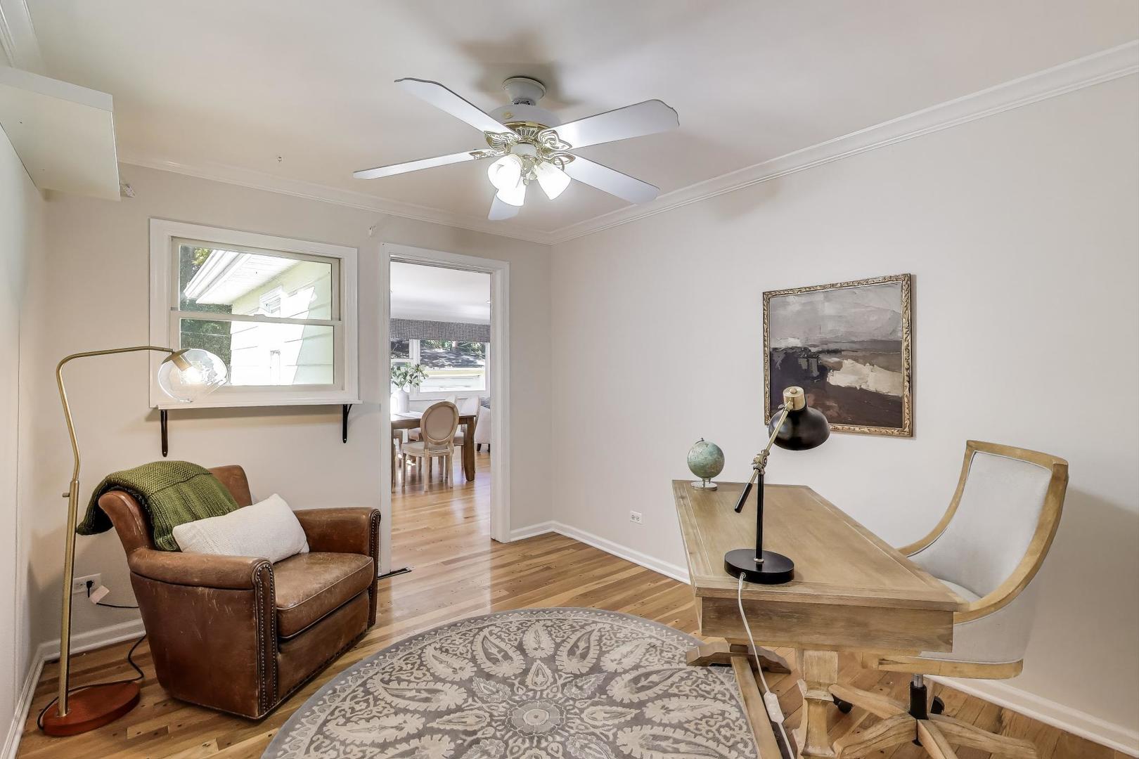 924 Lyford Lane Wheaton, IL 60189 - Photo 20 of 43 a living room with furniture a chandelier and wooden floor