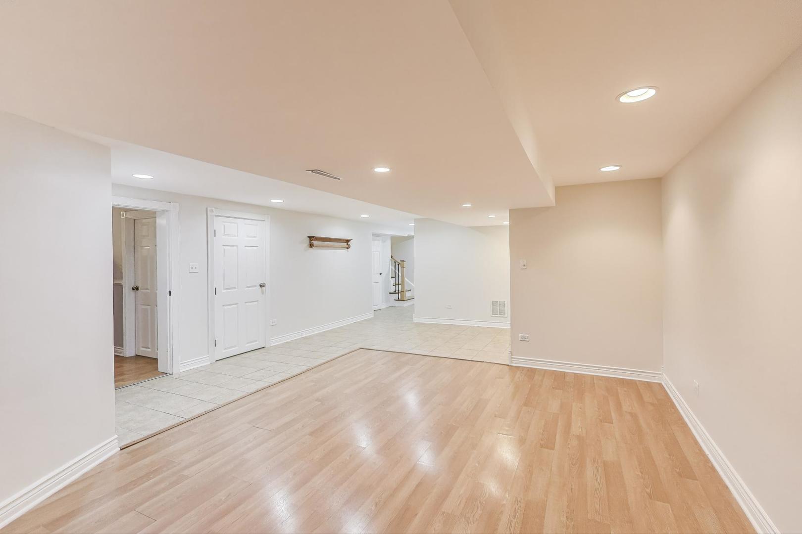 924 Lyford Lane Wheaton, IL 60189 - Photo 25 of 43 a view of an empty room with wooden floor