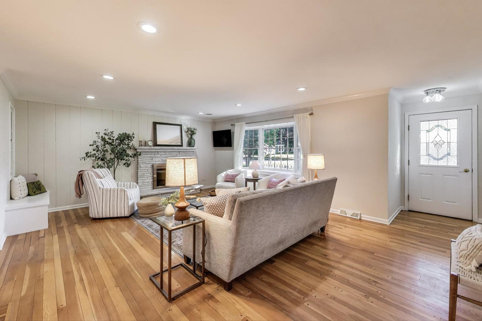 924 Lyford Lane Wheaton, IL 60189 - Photo 6 of 43 a living room with furniture and a wooden floor
