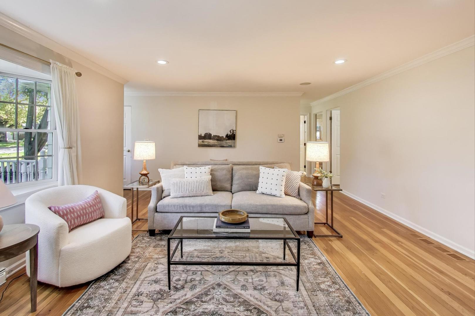 924 Lyford Lane Wheaton, IL 60189 - Photo 9 of 43 a living room with furniture and a rug