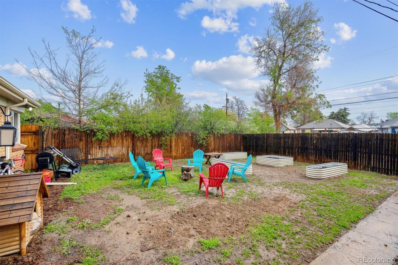2870 Pontiac Street Denver, CO 80207 - Photo 18 of 23 a view of yard with small play house and slide