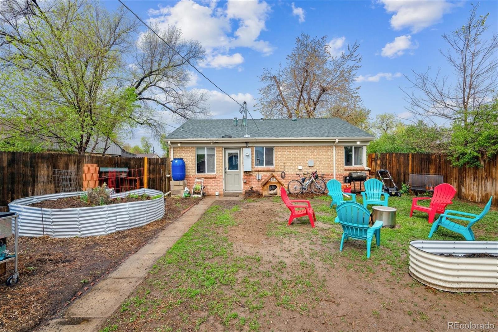2870 Pontiac Street Denver, CO 80207 - Photo 21 of 23 a view of outdoor space yard deck patio and fire pit