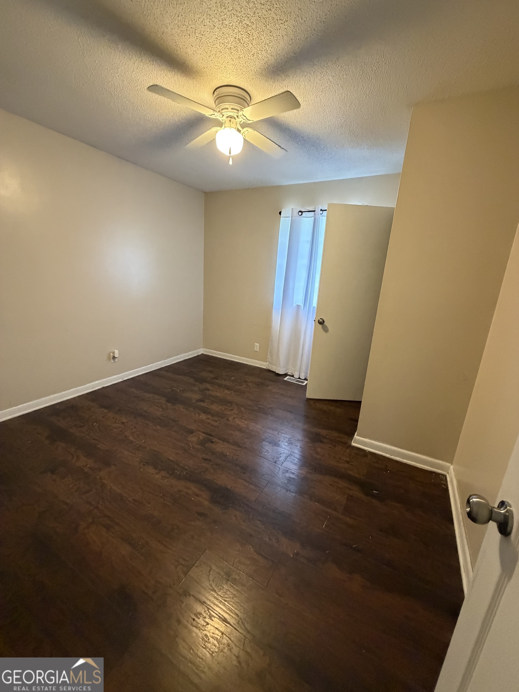 1144 Ridgeway Road LaFayette, GA 30728 - Photo 55 of 66 an empty room with wooden floor and windows
