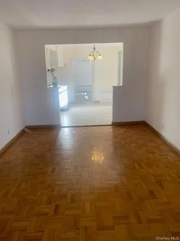 a view of a livingroom with a chandelier fan