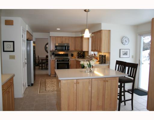 514 Trotwood Ridge Road Upper St. Clair, PA 15241 - Photo 6 of 18 Kitchen. The kitchen is equipped with a center island providing extra storage, a breakfact bar and great seving area for buffets and parties! Sliding doors provide access to the rear yard patio for easy outdoor dining or keeping an eye on the family!