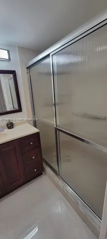 a view of a chandelier fan and closet in a room