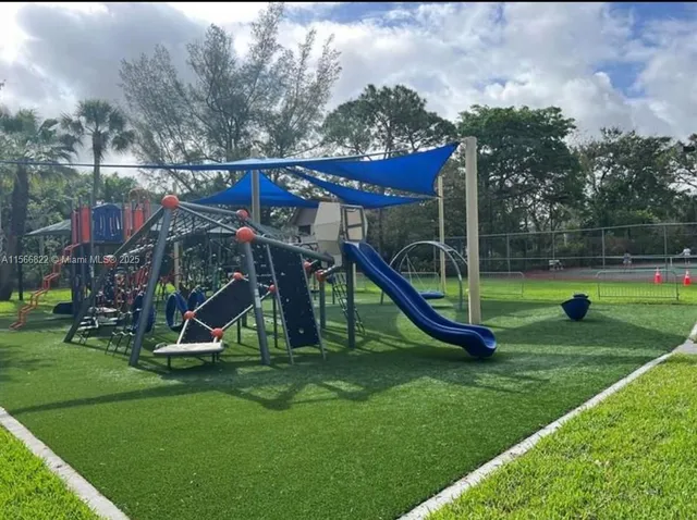 a view of a park with large trees