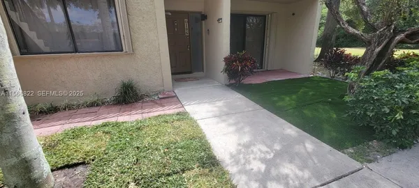 a view of a back yard of the house