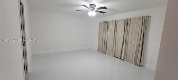 a bathroom with a shower and a toilet