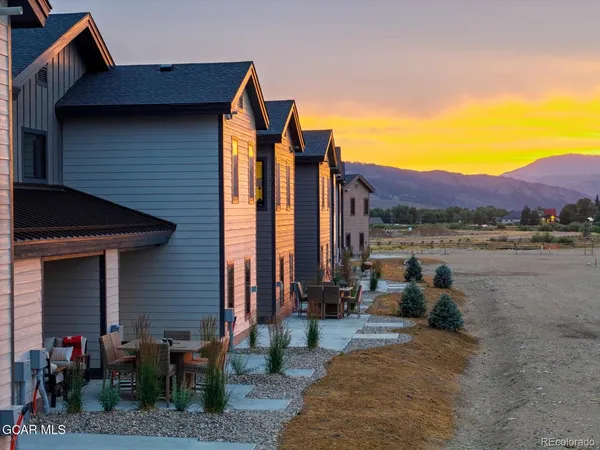 a view of two chairs in a patio