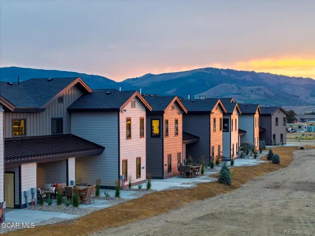 a front view of house with yard and seating space