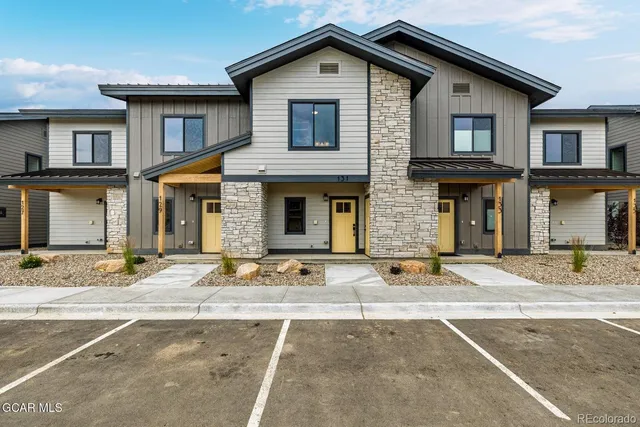 a outdoor living space with furniture and a floor to ceiling window