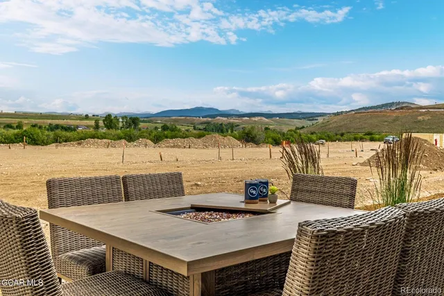 a view of a terrace with furniture and a table
