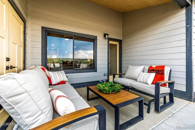 a outdoor living space with furniture and a potted plant