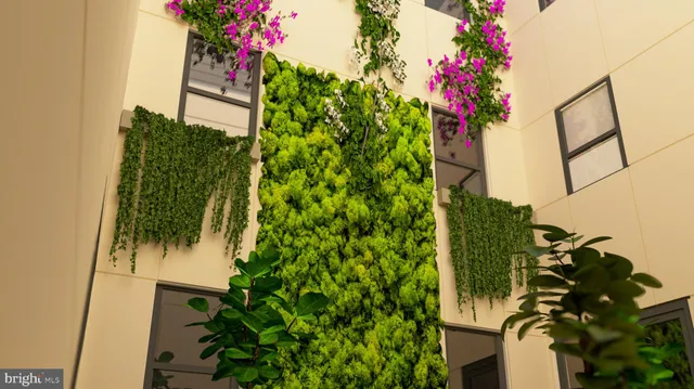 a vase of flowers sitting on a floor