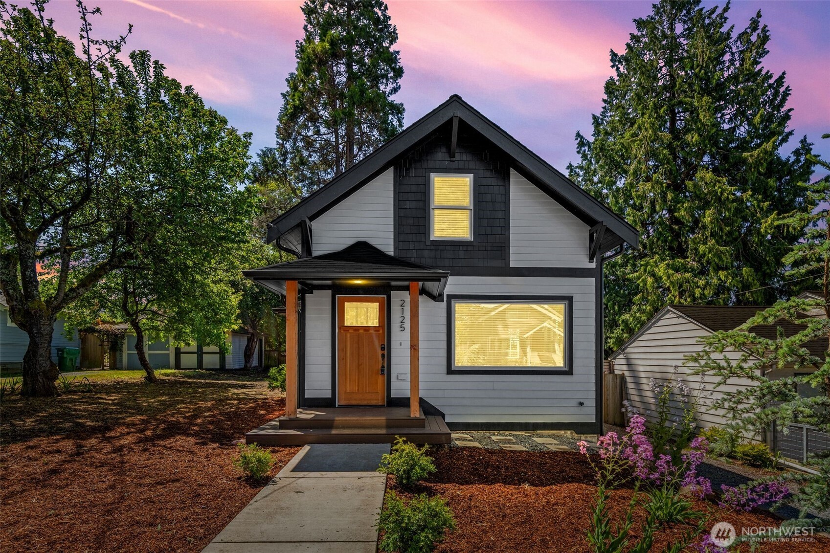 2125 North 90th Street Seattle, WA 98103 - Photo 2 of 29 a front view of a house with garden